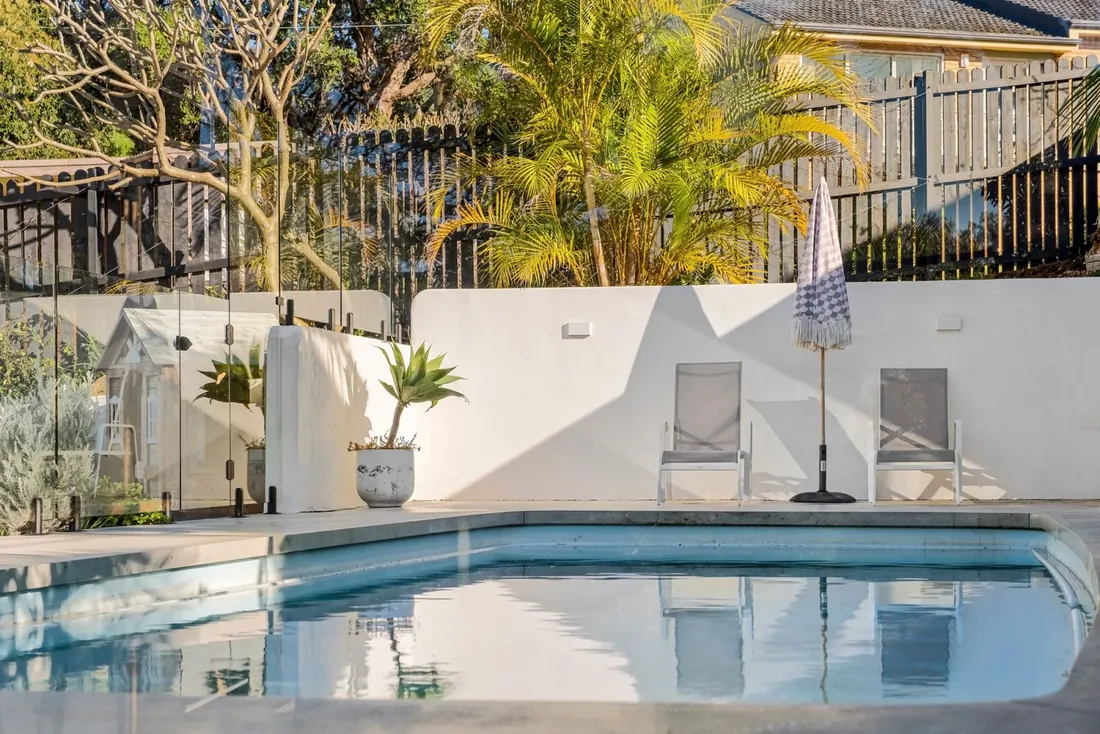 A compliant pool barrier — the fence, gate and non-climbable zone a Form 23 inspection checks after you register your pool