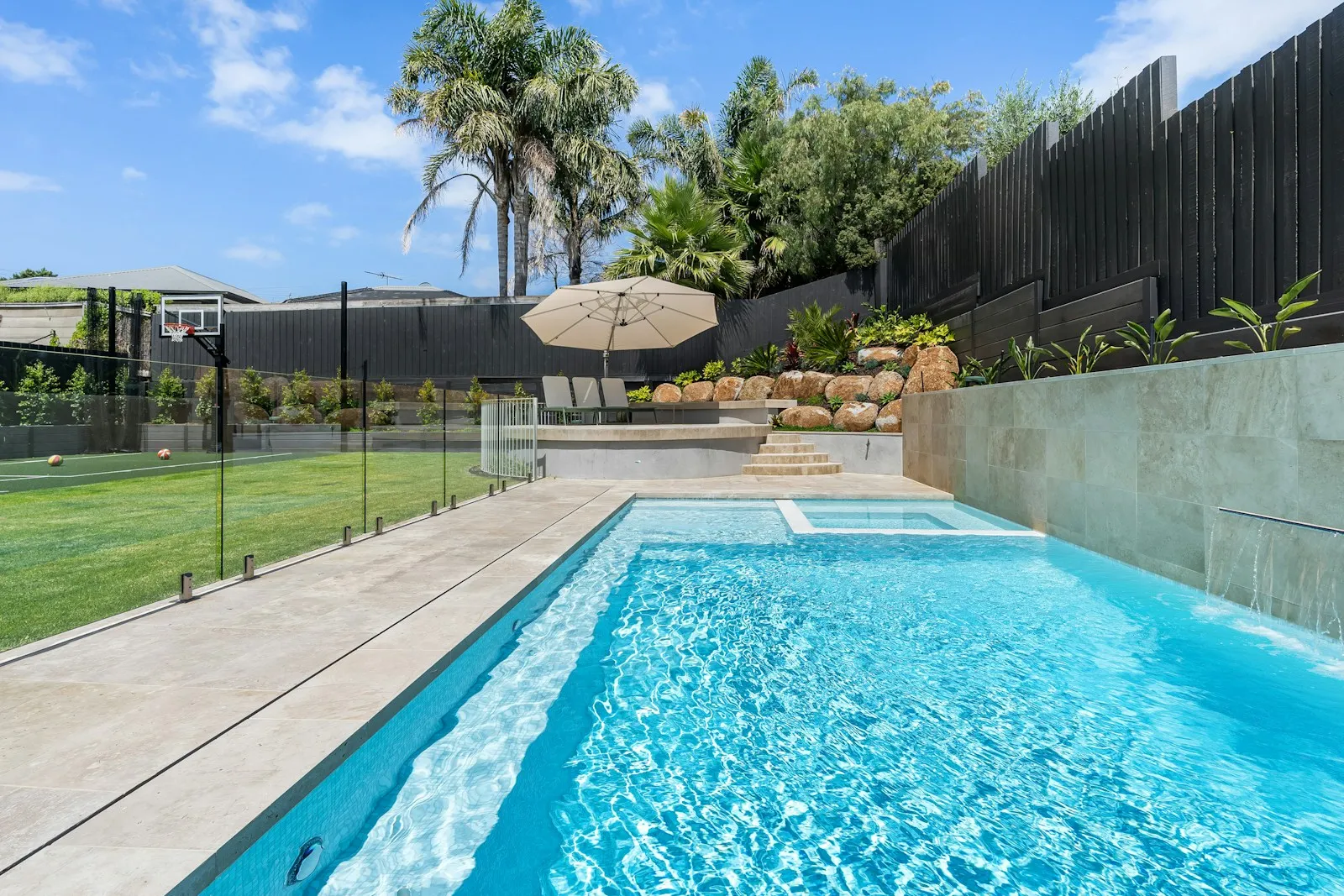 Ryan Gaw, VBA-registered pool safety inspector (IN-PS 100055), assessing a pool fence barrier at a residential property in Geelong, Victoria